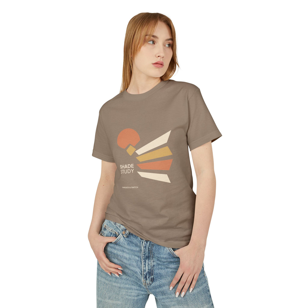 Model mockup of Shade Study Geometric Graphic Tee in Faded Brown, front view showing a cut circular shape and radiating angular planes with Shade Study lettering.