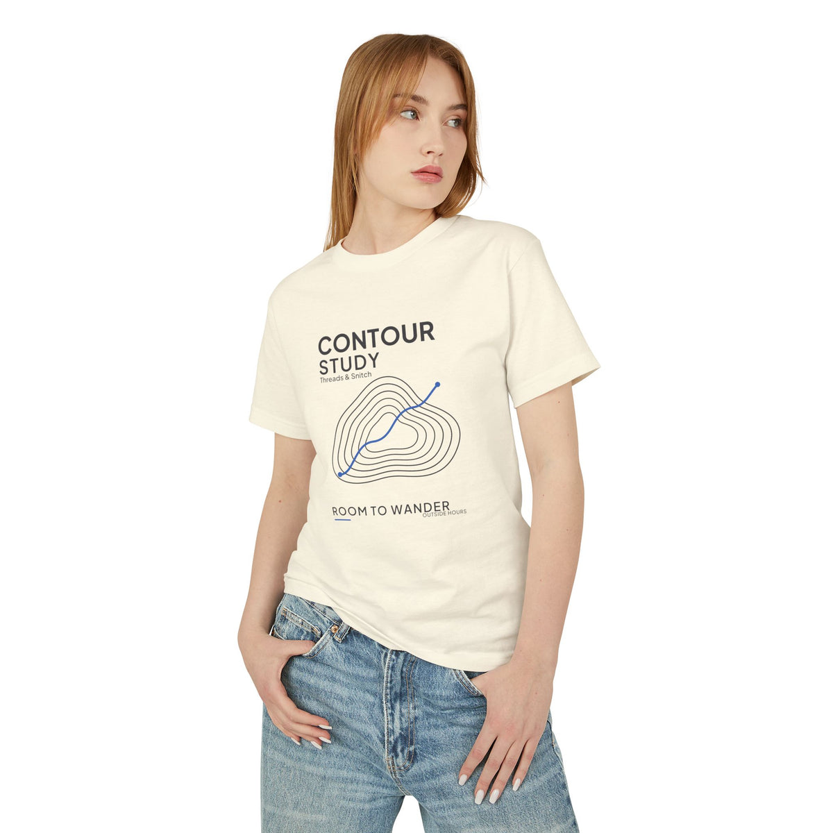 Front-view model mockup of Contour Study Topographic Tee in Faded Cream, showing contour lines crossed by a blue route.