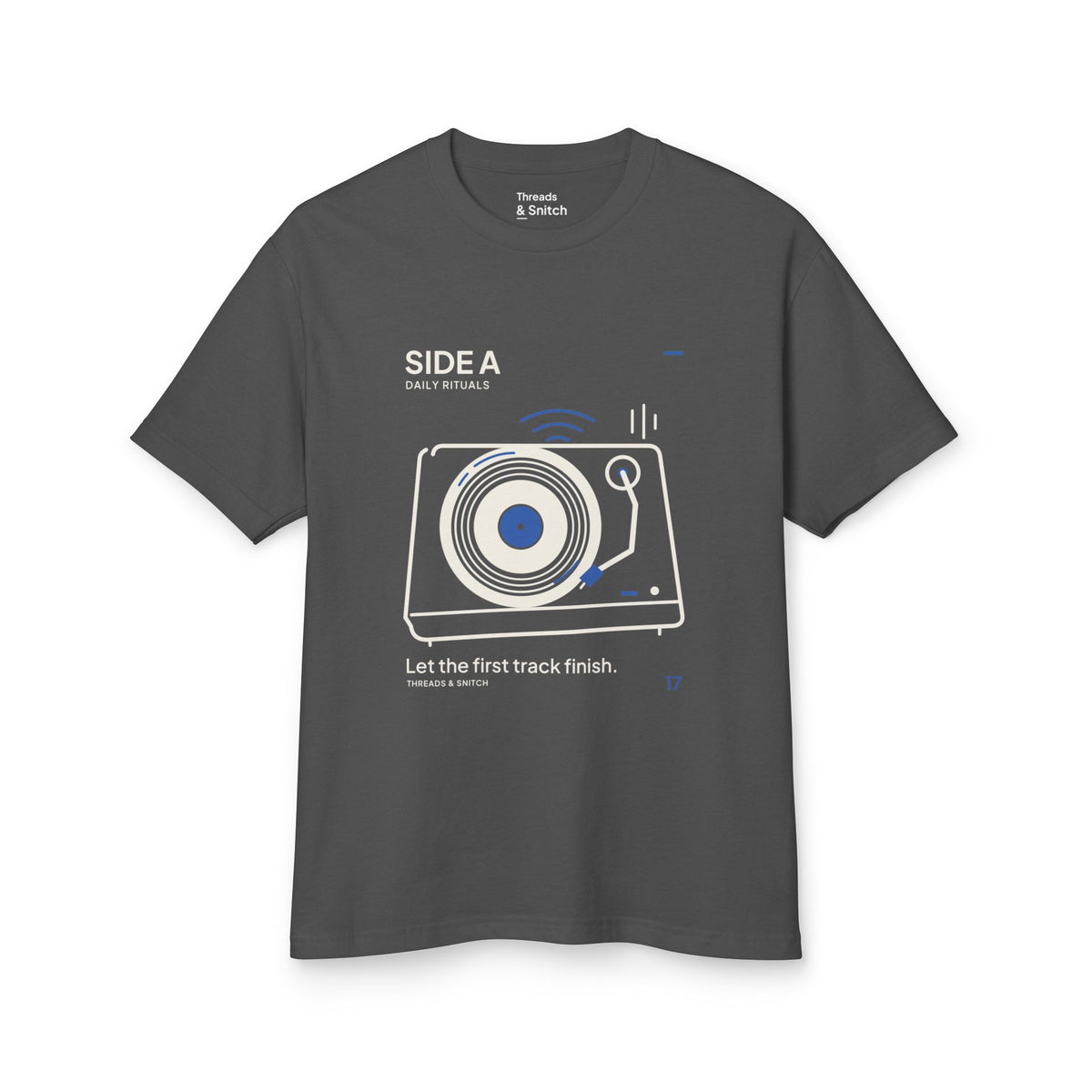 Mockup of Side A Record Player Tee in Faded Black, front view showing record player with open circular grooves, tonearm and blue sound marks.
