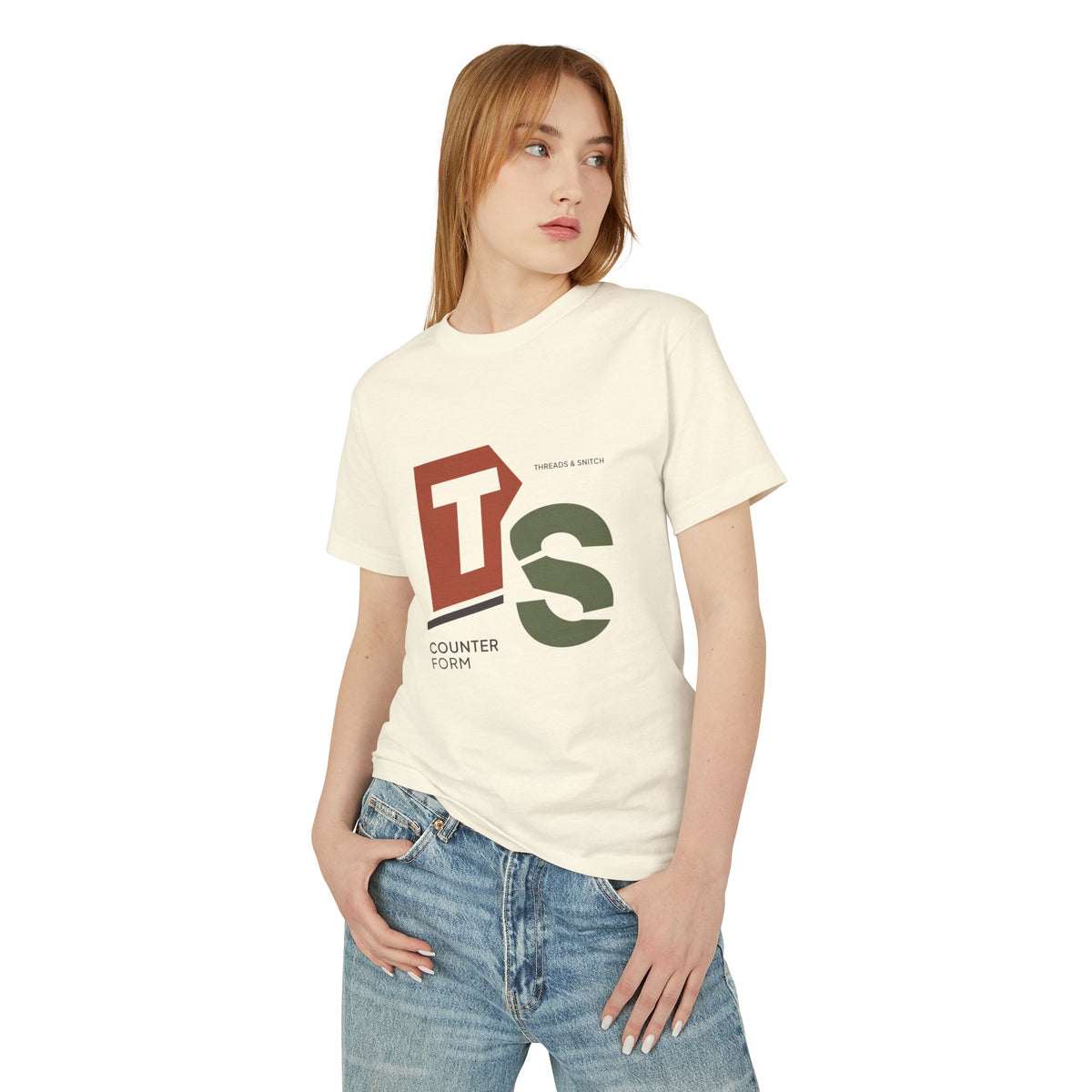 Model mockup of Counterform Abstract Letter Graphic Tee in Faded Cream, front view showing abstract T and S letterforms with Counterform lettering.