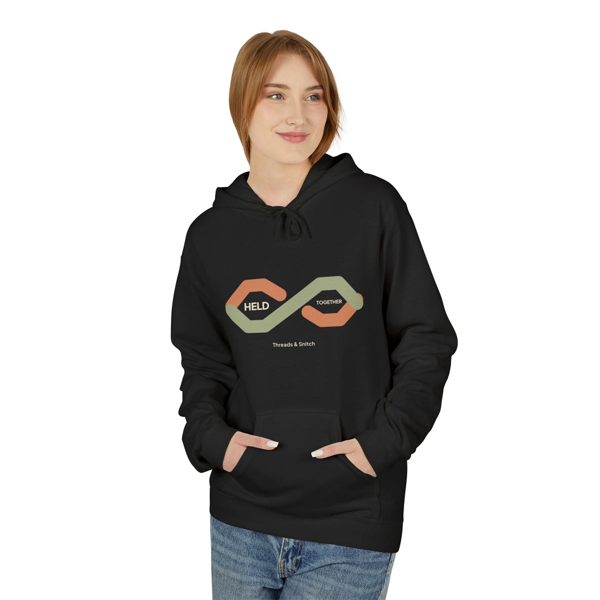 Model mockup of Held Together Knot Graphic Hoodie in Black, front view showing overlapping segmented ribbons forming a knot with Held Together lettering.
