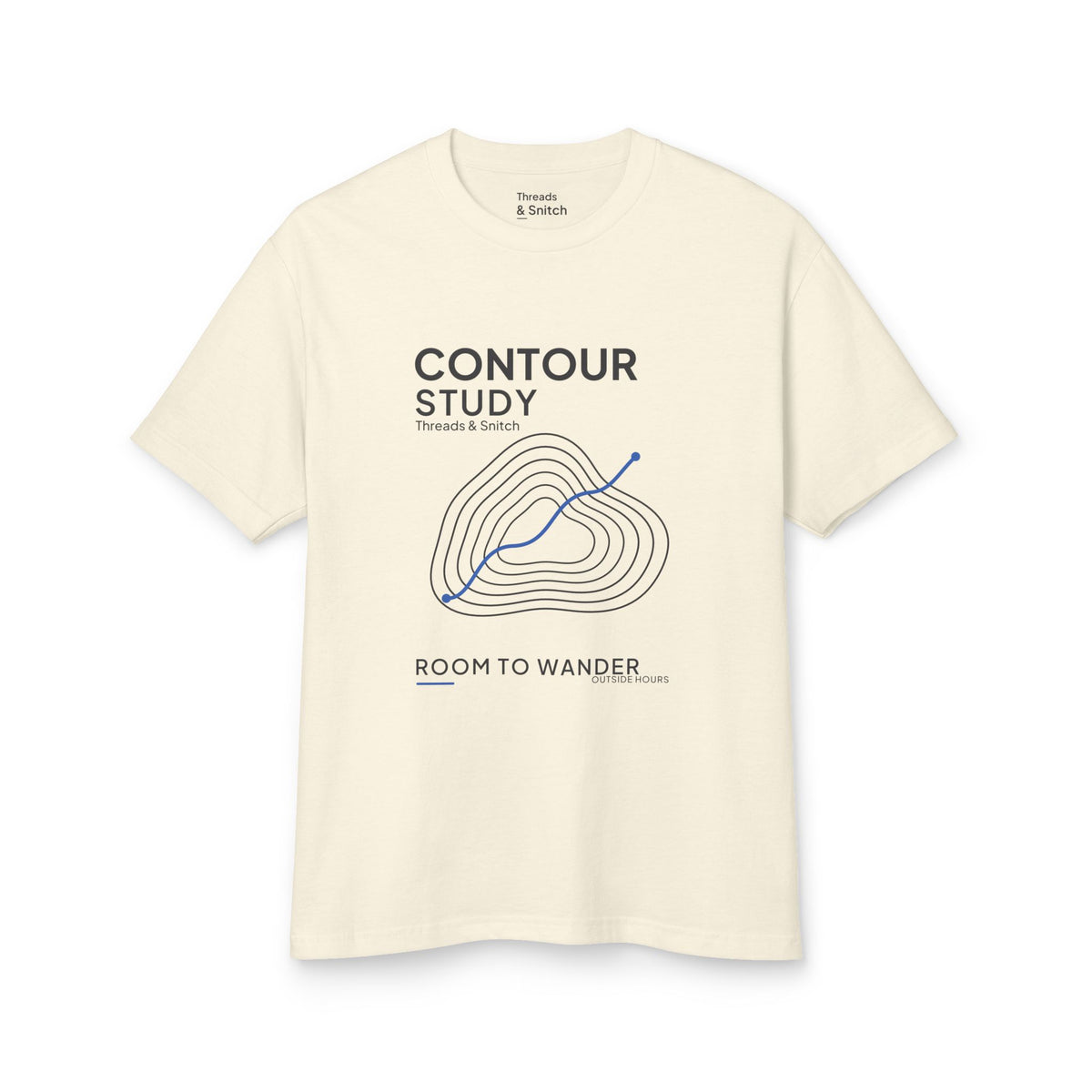 Mockup of Contour Study Topographic Tee in Faded Cream, front view showing contour lines crossed by a blue route.