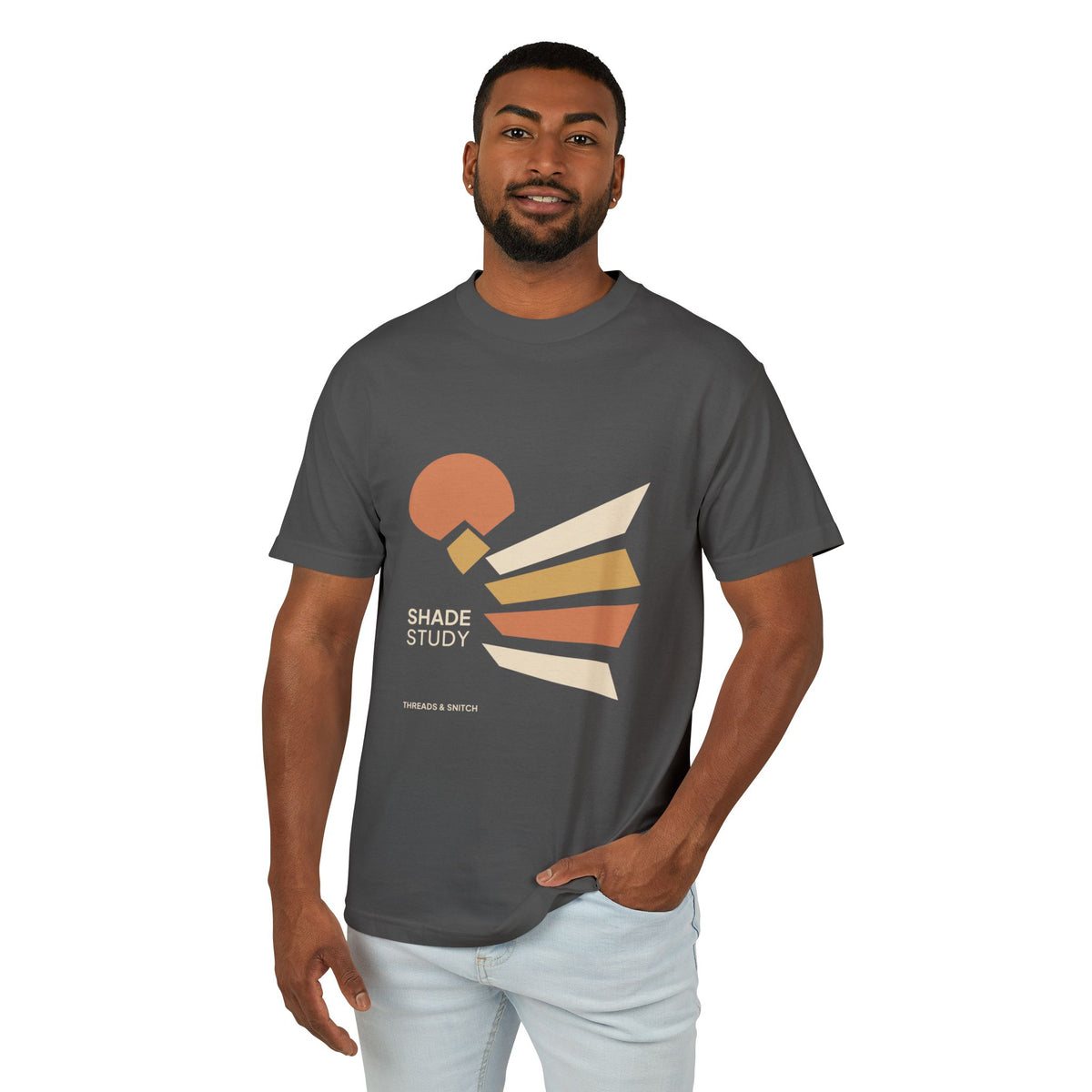 Model mockup of Shade Study Geometric Graphic Tee in Faded Black, front view showing a cut circular shape and radiating angular planes with Shade Study lettering.