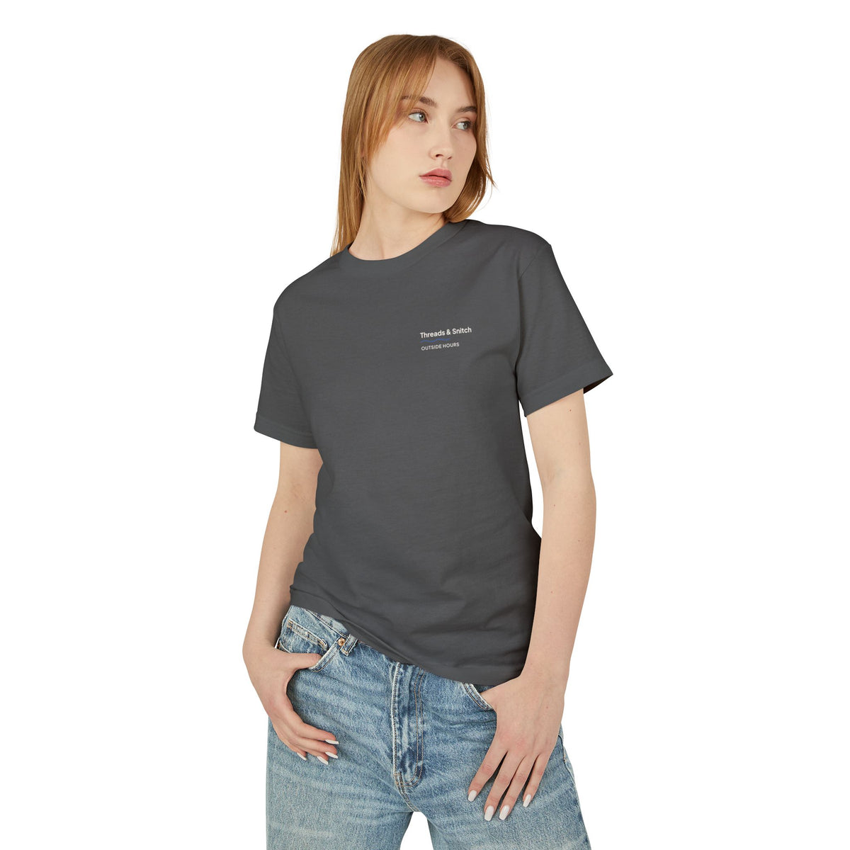 Front-view model mockup of Shore Study Bird Graphic Tee in Faded Black, showing the small left-chest signature.