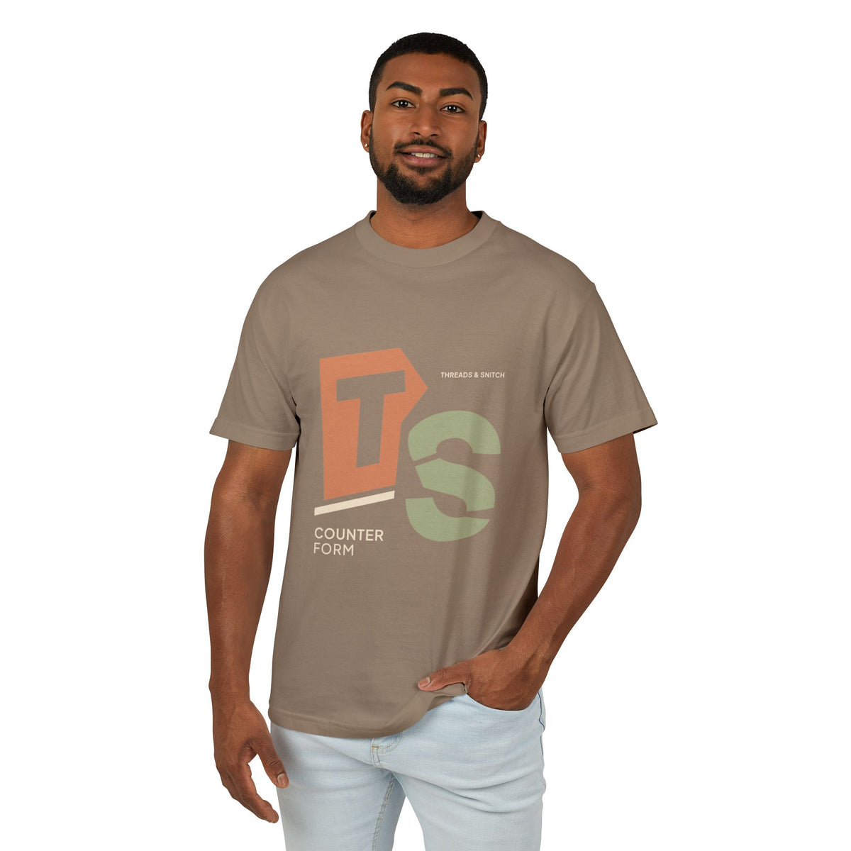 Model mockup of Counterform Abstract Letter Graphic Tee in Faded Brown, front view showing abstract T and S letterforms with Counterform lettering.