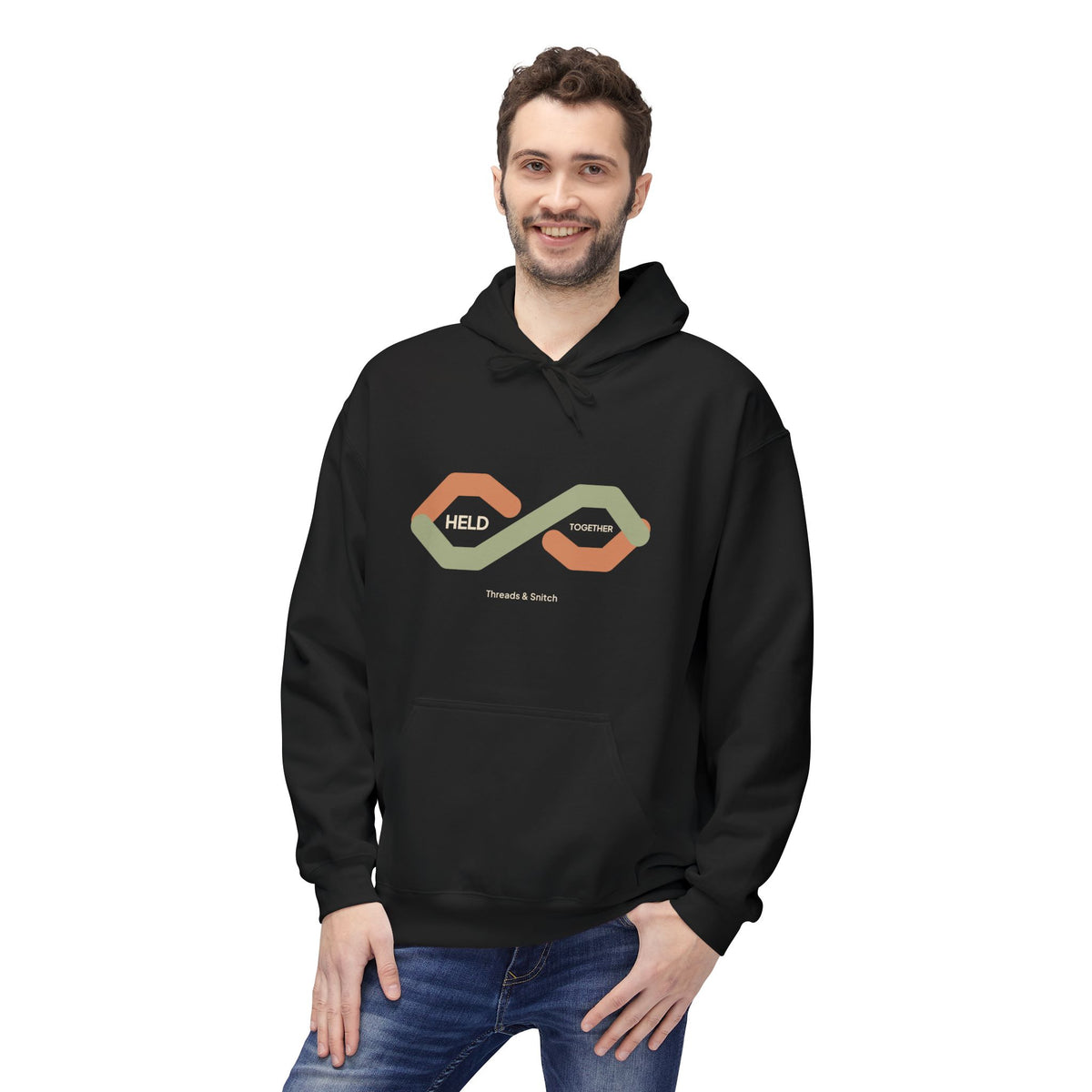 Model mockup of Held Together Knot Graphic Hoodie in Black, front view showing overlapping segmented ribbons forming a knot with Held Together lettering.