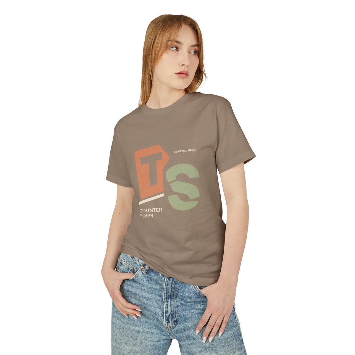 Model mockup of Counterform Abstract Letter Graphic Tee in Faded Brown, front view showing abstract T and S letterforms with Counterform lettering.