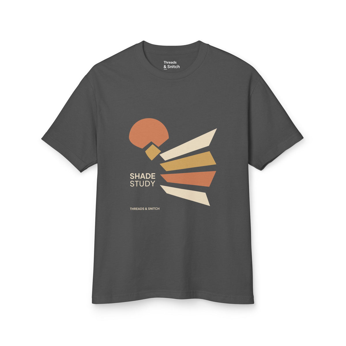 Mockup of Shade Study Geometric Graphic Tee in Faded Black, front view showing a cut circular shape and radiating angular planes with Shade Study lettering.