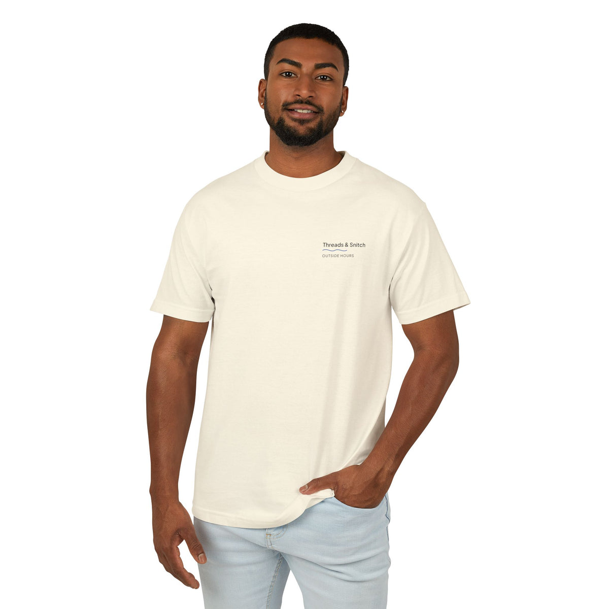 Front-view model mockup of Shore Study Bird Graphic Tee in Faded Cream, showing the small left-chest signature.
