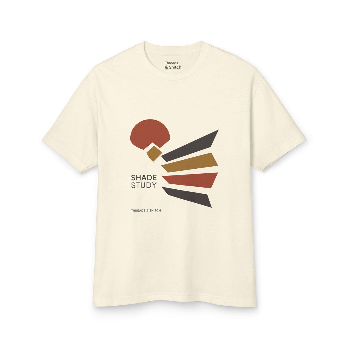Mockup of Shade Study Geometric Graphic Tee in Faded Cream, front view showing a cut circular shape and radiating angular planes with Shade Study lettering.