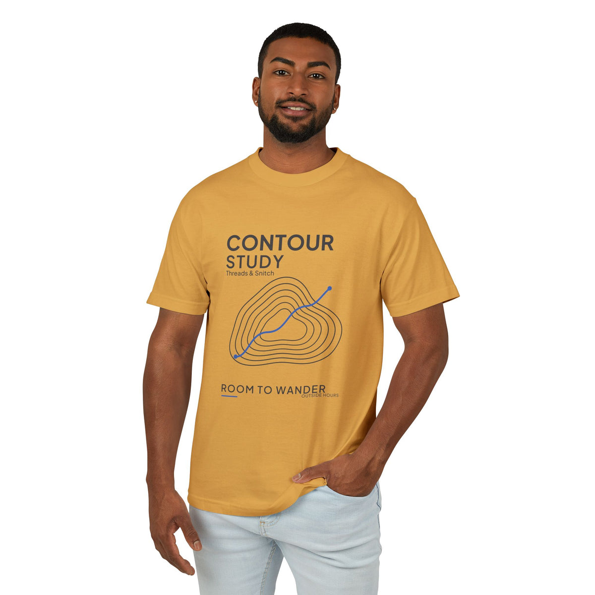 Front-view model mockup of Contour Study Topographic Tee in Faded Mustard, showing contour lines crossed by a blue route.