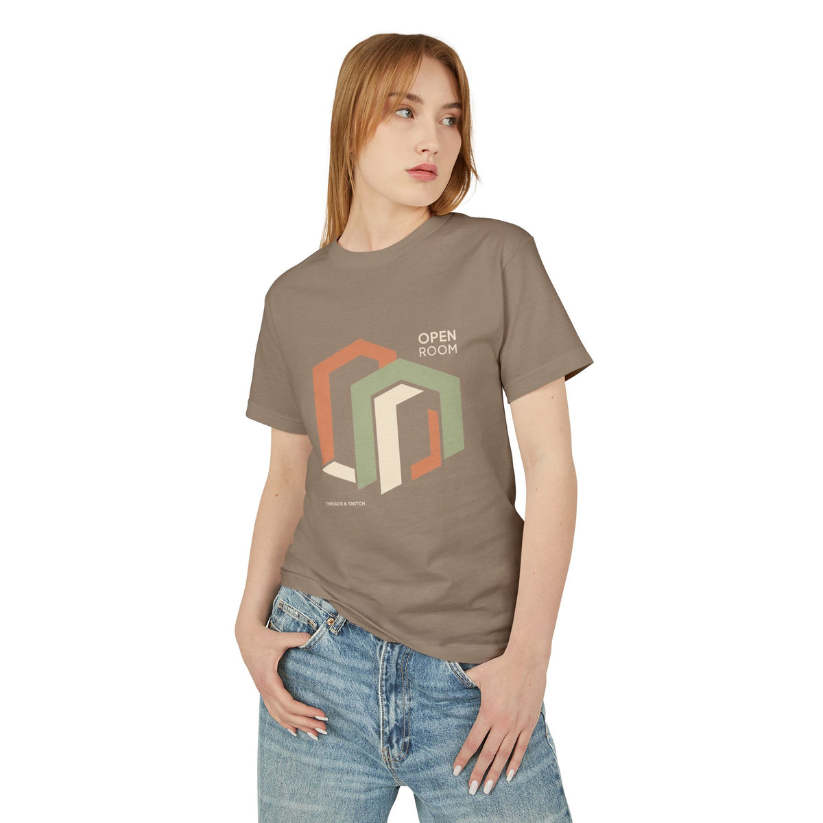 Model mockup of Open Room Architectural Graphic Tee in Faded Brown, front view showing overlapping open doorway shapes with Open Room lettering.