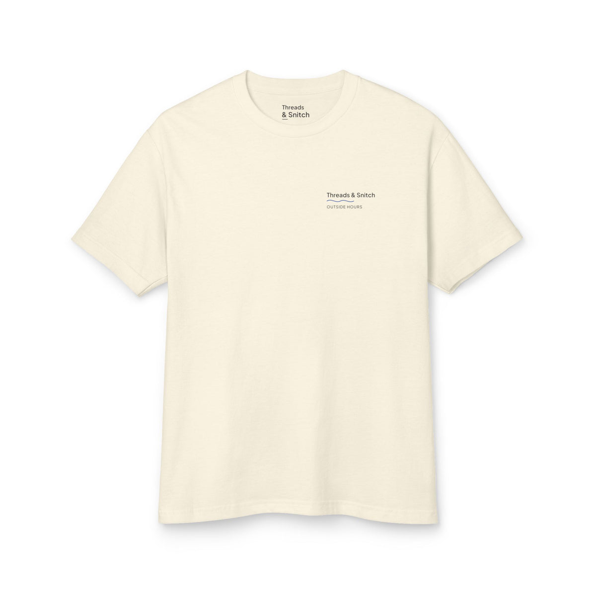 Mockup of Shore Study Bird Graphic Tee in Faded Cream, front view showing a small left-chest signature.