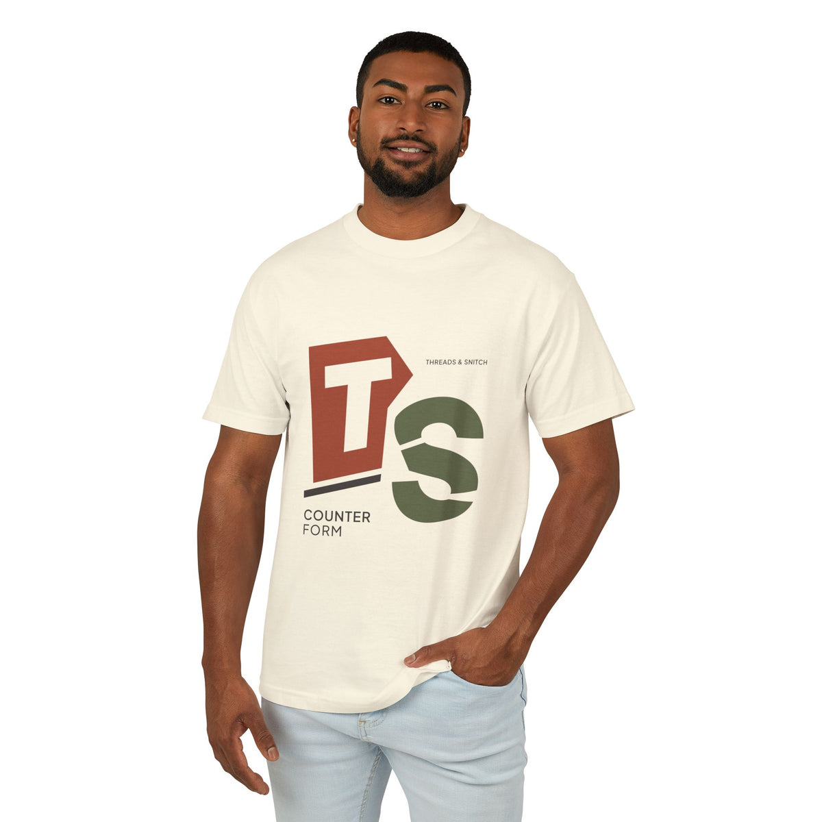 Model mockup of Counterform Abstract Letter Graphic Tee in Faded Cream, front view showing abstract T and S letterforms with Counterform lettering.