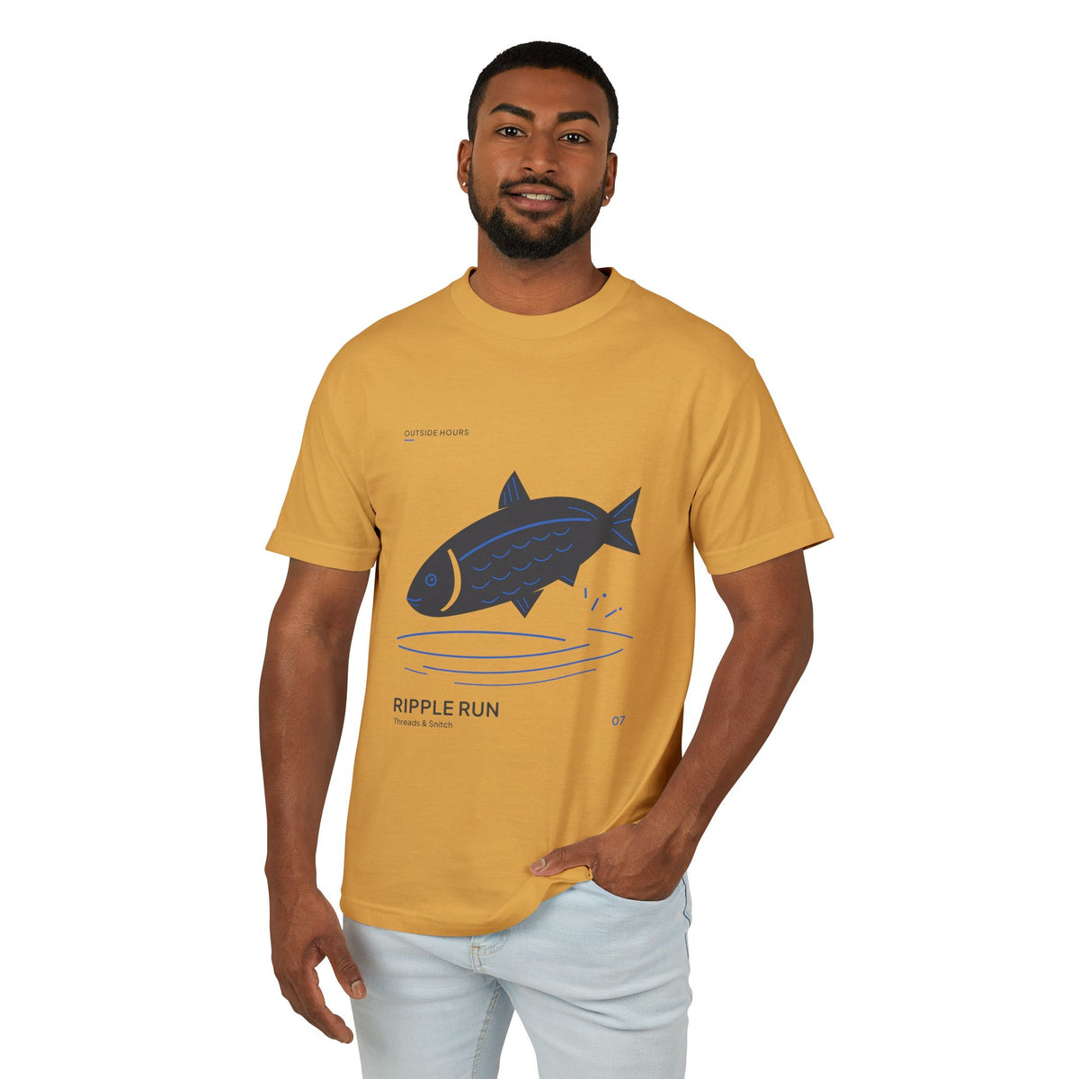 Model mockup of Ripple Run Fish Graphic Tee in Faded Mustard, front view showing fish above wide blue water ripples.