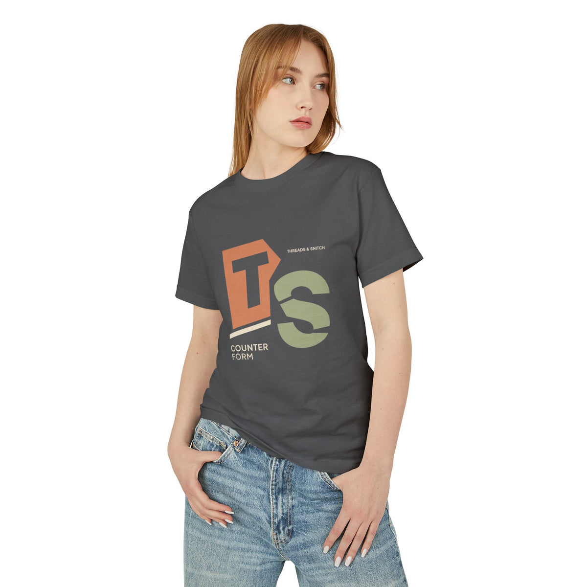 Model mockup of Counterform Abstract Letter Graphic Tee in Faded Black, front view showing abstract T and S letterforms with Counterform lettering.
