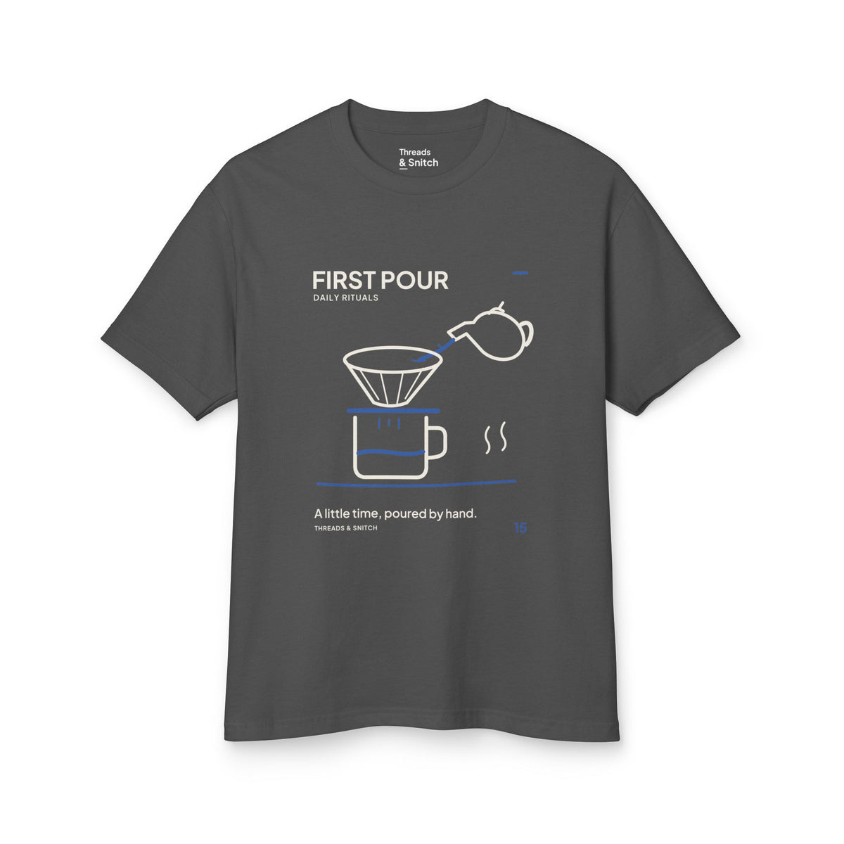 Mockup of First Pour Coffee Graphic Tee in Faded Black, front view showing kettle pouring blue water into a coffee filter above a brew pot.