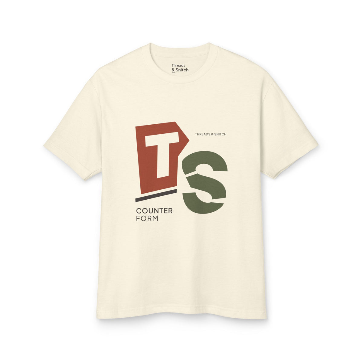 Mockup of Counterform Abstract Letter Graphic Tee in Faded Cream, front view showing abstract T and S letterforms with Counterform lettering.