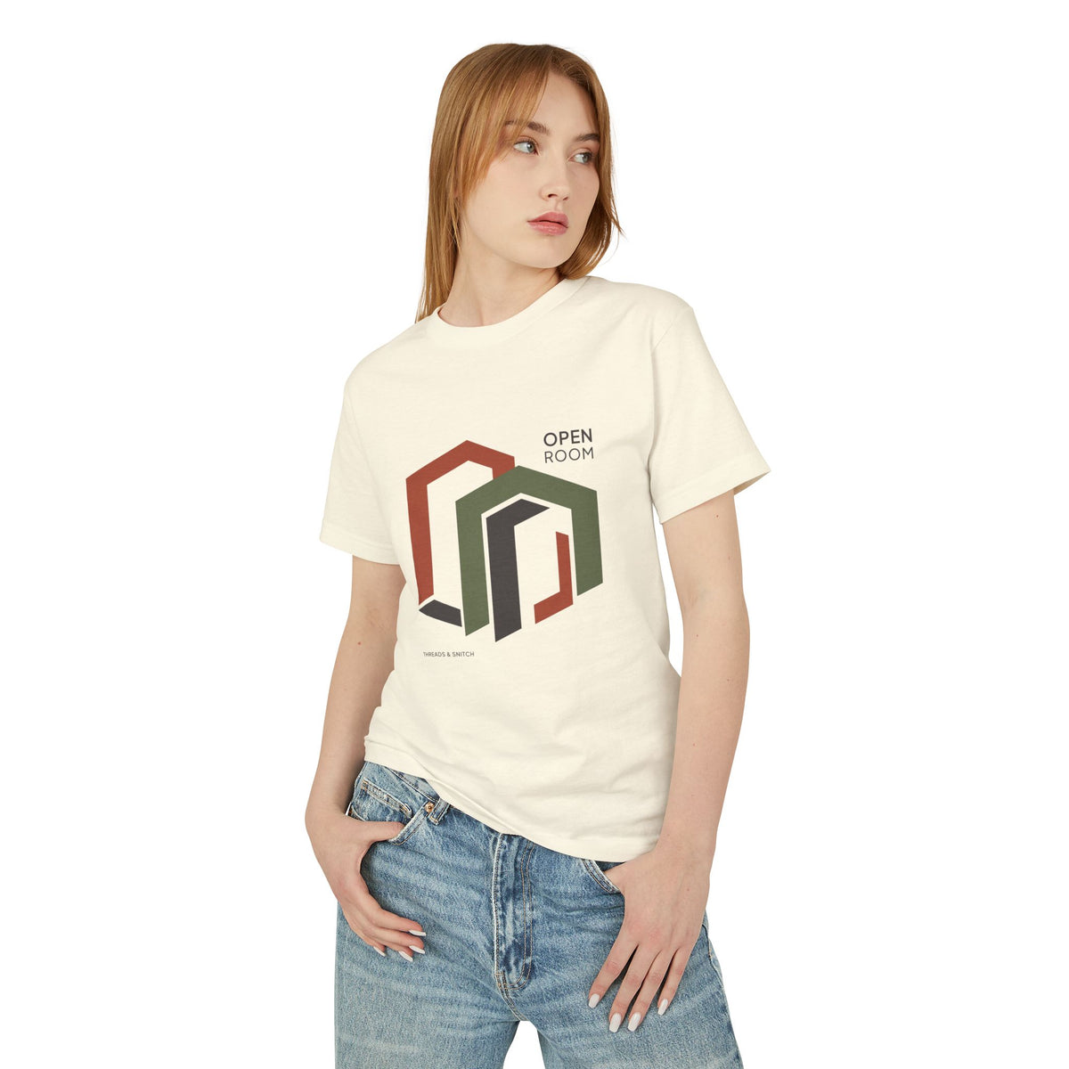 Model mockup of Open Room Architectural Graphic Tee in Faded Cream, front view showing overlapping open doorway shapes with Open Room lettering.