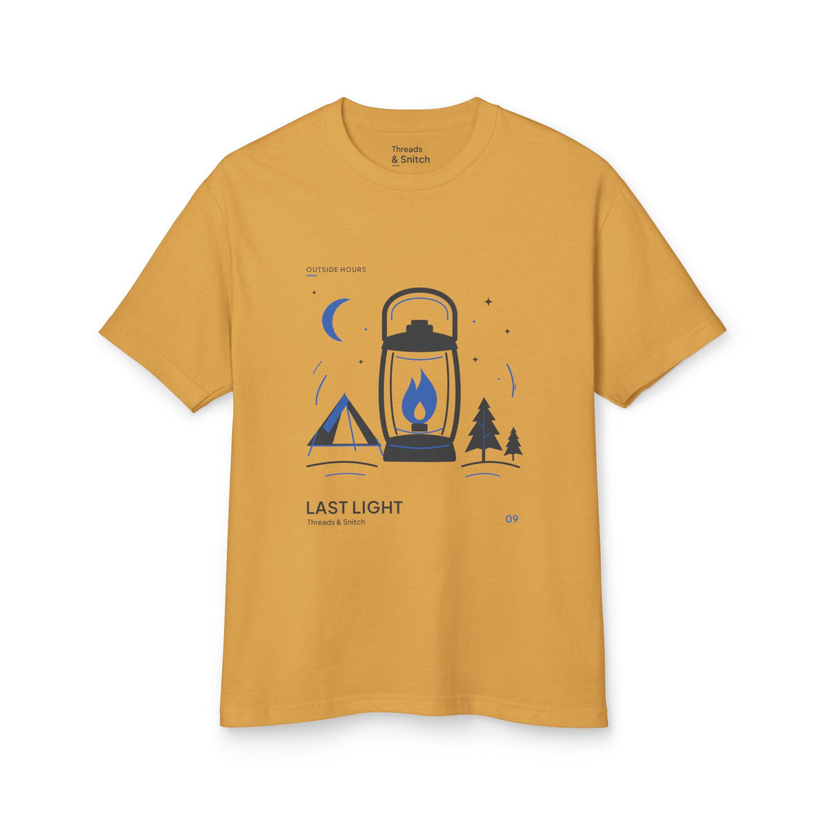 Mockup of Last Light Lantern Graphic Tee in Faded Mustard, front view showing lantern, tent, trees and blue crescent moon.