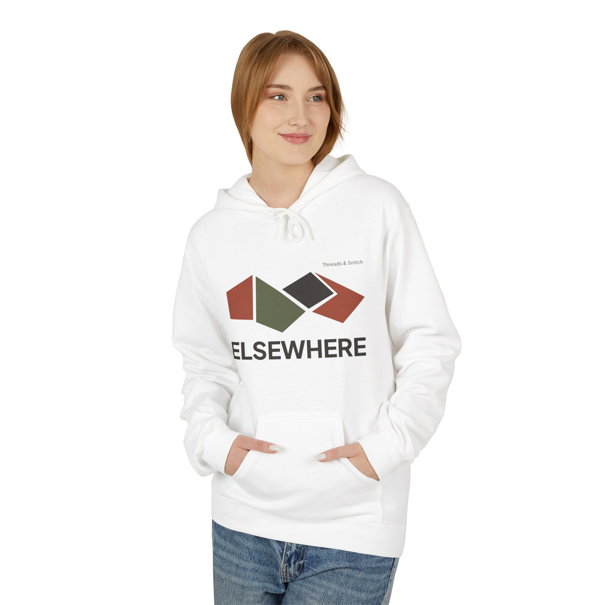 Model mockup of Elsewhere Folded Form Graphic Hoodie in White, front view showing four folded paper-like panels above Elsewhere lettering.